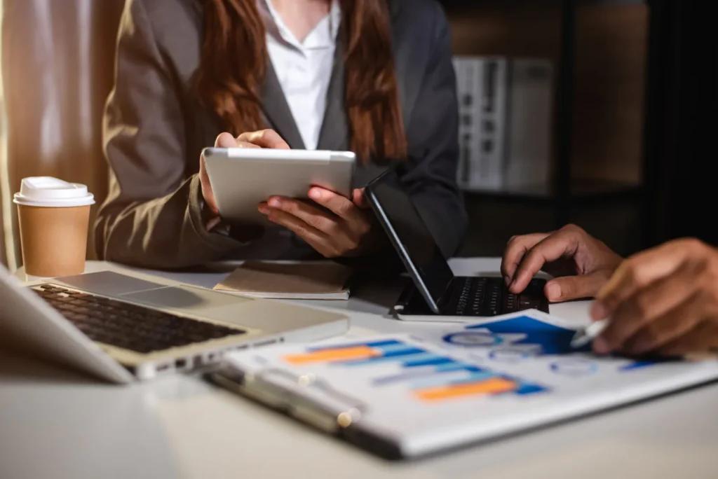 Business People Talking Discussing With Financial Document Data