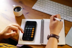 Closeup Shot Of An Entrepreneur Working From Home And Doing Calculations